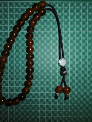 Handmade worry beads with 33+2 red acrylic beads, silver shield