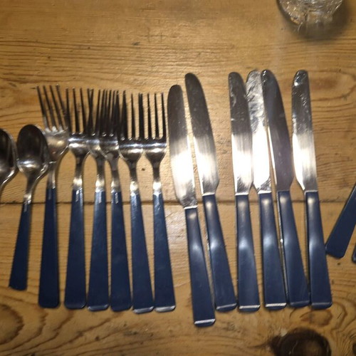 Blue cutlery set used, missing small spoon