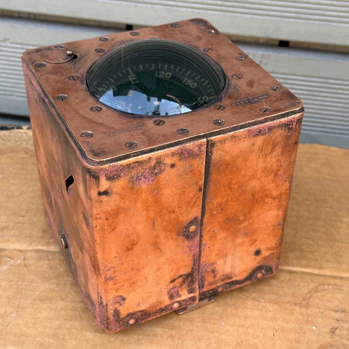 Old copper submarine compass used with artificial horizon
