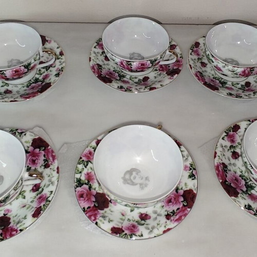 Vintage porcelain tea cups set with floral rose pattern and lithophany