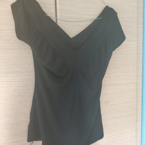 Basic black blouse used with v-neck and chest gathers