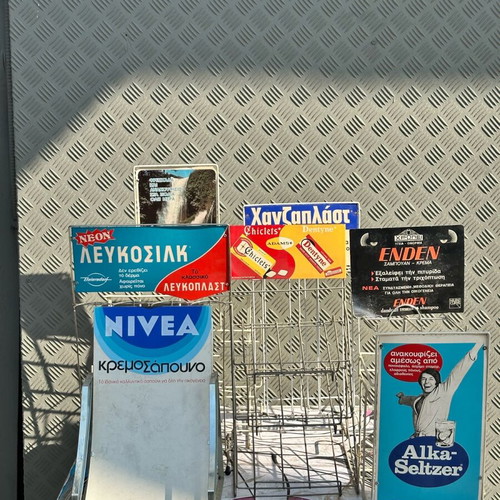 Retro kiosk stand used with authentic vintage advertisements