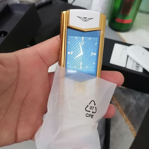 Vertu phone new, gold with metal leather body and dual card slot