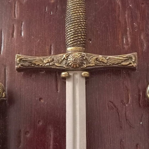 Decorative historical swords used with wooden base and metal mounts