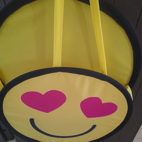 Decorative emoji wall hanging with heart eyes