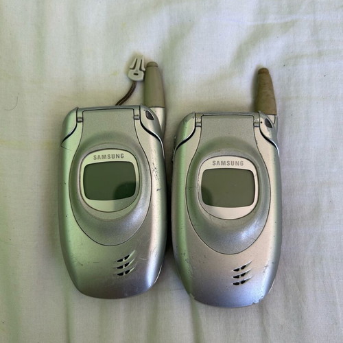 Samsung T100 phone set used, one works, one for parts