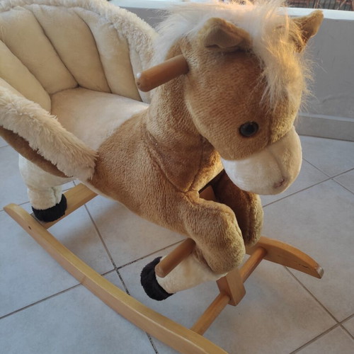 Wooden rocking horse like new with plush carriage
