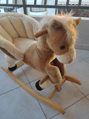 Wooden rocking horse like new with plush carriage
