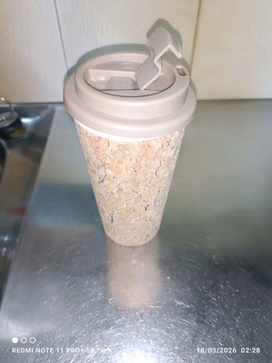 Plastic cup used with cork exterior and lid