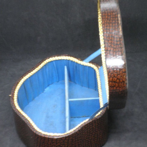Antique jewelry box used, brown color with blue fabric interior