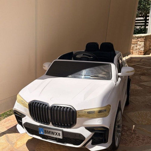 BMW Electric Ride-On Car like new with remote control and charger