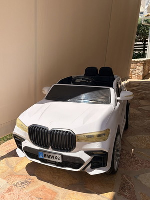 BMW Electric Ride-On Car like new with remote control and charger
