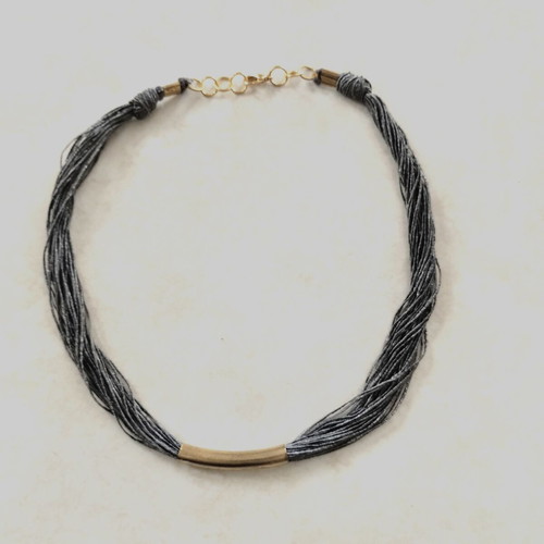 Minimal handmade necklace used, silk thread with metal element