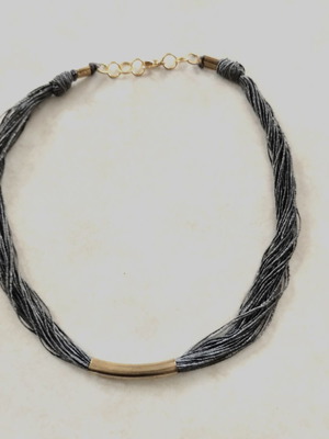 Minimal handmade necklace used, silk thread with metal element