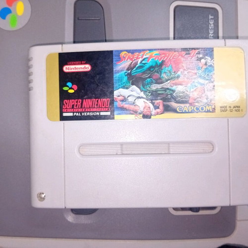 Super Nintendo 1990 console with 2 controllers and 3 games