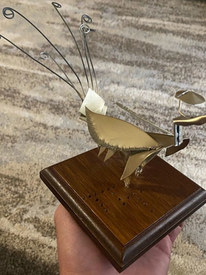 Metal decorative item like new with wooden base