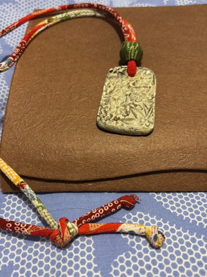 Necklace with fabric strap and stone like new, red