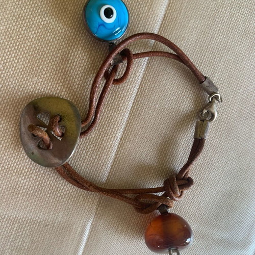 Silver craft elements set with eye and stone
