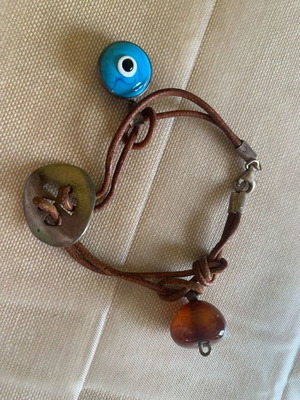 Silver craft elements set with eye and stone