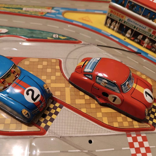 Race track toy with 3 wind-up cars used, 1960, metal