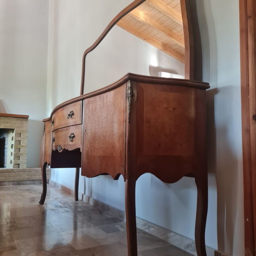 Classic wooden buffet with large curved mirror