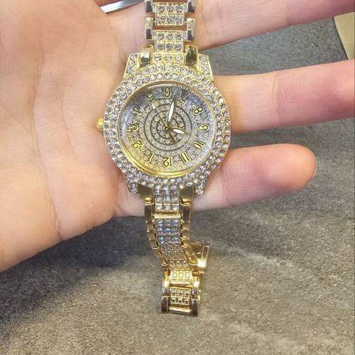 Women's wristwatch new with crystals, yellow gold