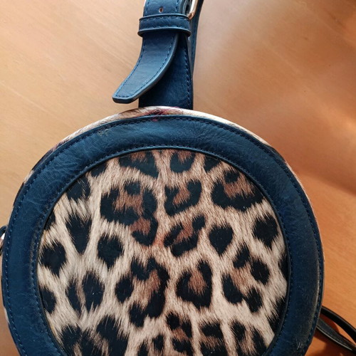 Crossbody bag like new dark blue round with animal print patent