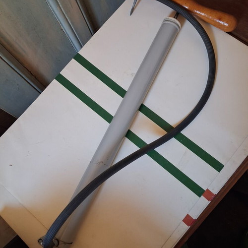 Manual air pump used with wooden handle and flexible hose