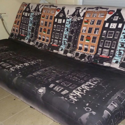 Sofa bed used, three-seater black with Amsterdam cover and storage