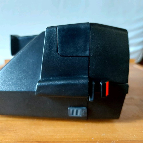 Polaroid Supercolor 635CL vintage instant camera used with strap