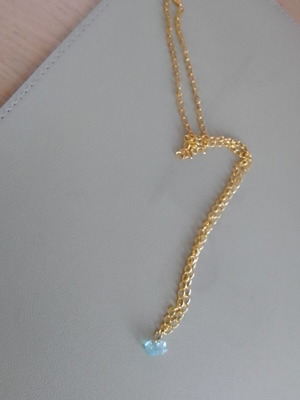Necklace new with dangling light blue beads on gold