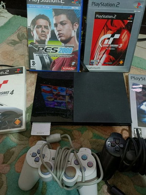 PlayStation 2 used in excellent condition with 4 games