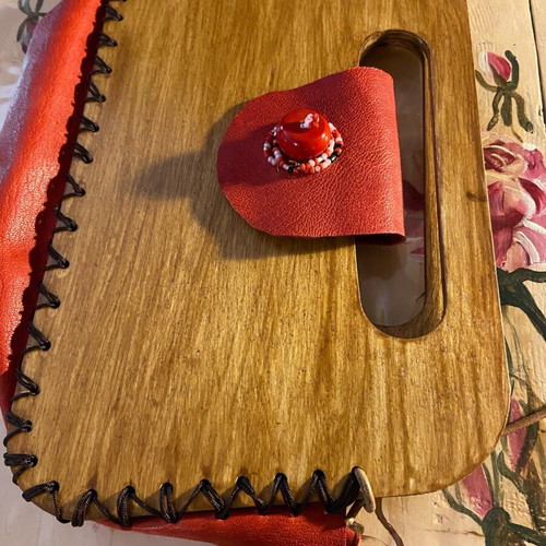 Wooden handmade bag with red leather stitched by hand