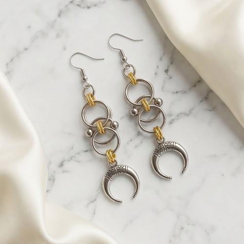 Steel earrings with gold-silver bicolor and crescent moon design