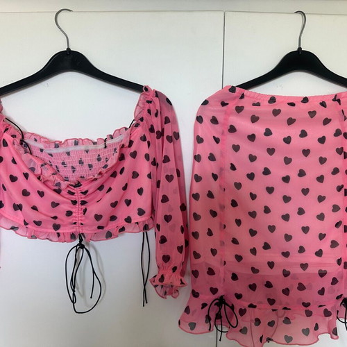 Top and skirt set pink with black hearts, like new, size small
