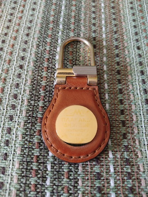 Keychain used, brown leatherette with gold details