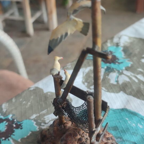 Vintage sea-themed decoration handmade from metal and cork used
