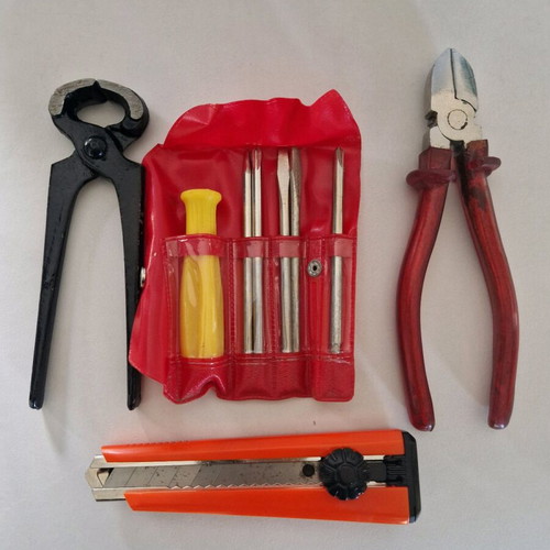 Tool set new with pliers, electrician side cutter, folding knife and screwdrivers