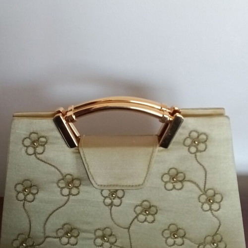 Small gold handbag with handle and long chain, like new