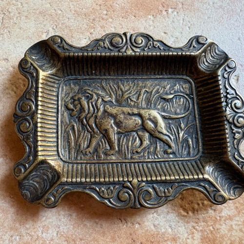 Vintage brass ashtray with lion carving, like new