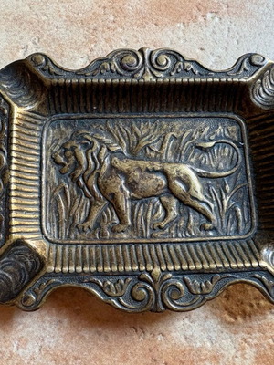 Vintage brass ashtray with lion carving, like new