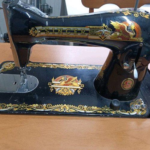 Singer antique sewing machine like new with cabinet