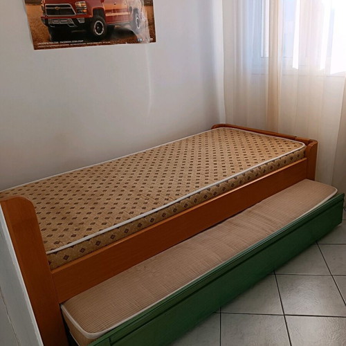 Single bed with used sliding bed and metal frame