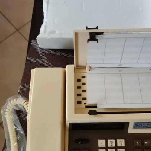 Vintage tabletop telephone with calculator and directory, new