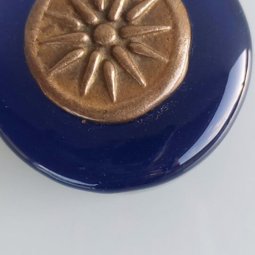Paperweight made of blown glass with Vergina Sun bronze decoration