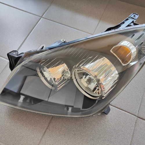 Opel Astra H left headlight genuine, used, electric