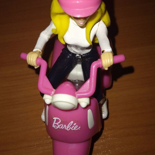 Barbie figure on motorcycle used with motion