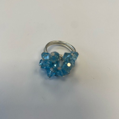 3D ring with bright blue moving crystals like new