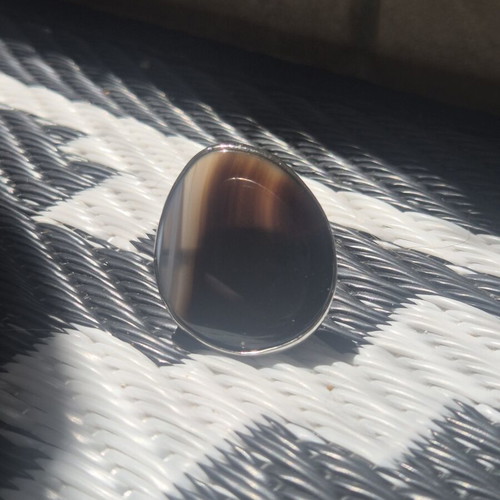 Adjustable ring like new, brown