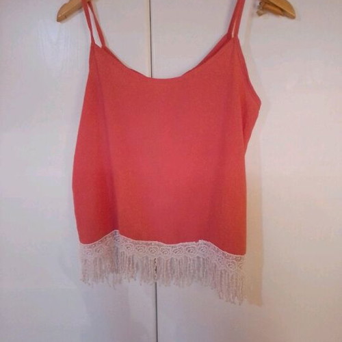 Blouse new with bow back and fringes bottom size L